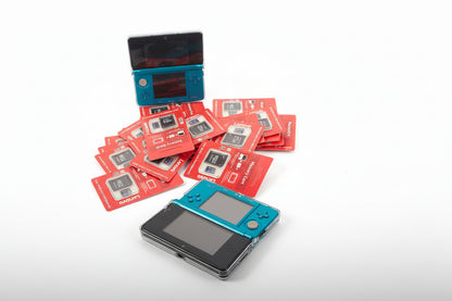 Two blue gaming devices with red cards featuring game icons on a white background Retro handheld gaming console 128GB SD professionally modded pre-installed games emulators custom firmware UK ModxGaming