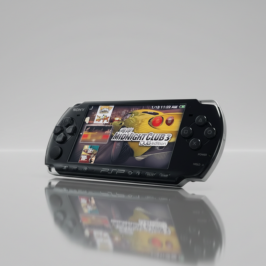 Modded PSP-3000 handheld console in piano black, angled on a light reflective surface with screen displaying Midnight Club 3 — ModxGaming UK