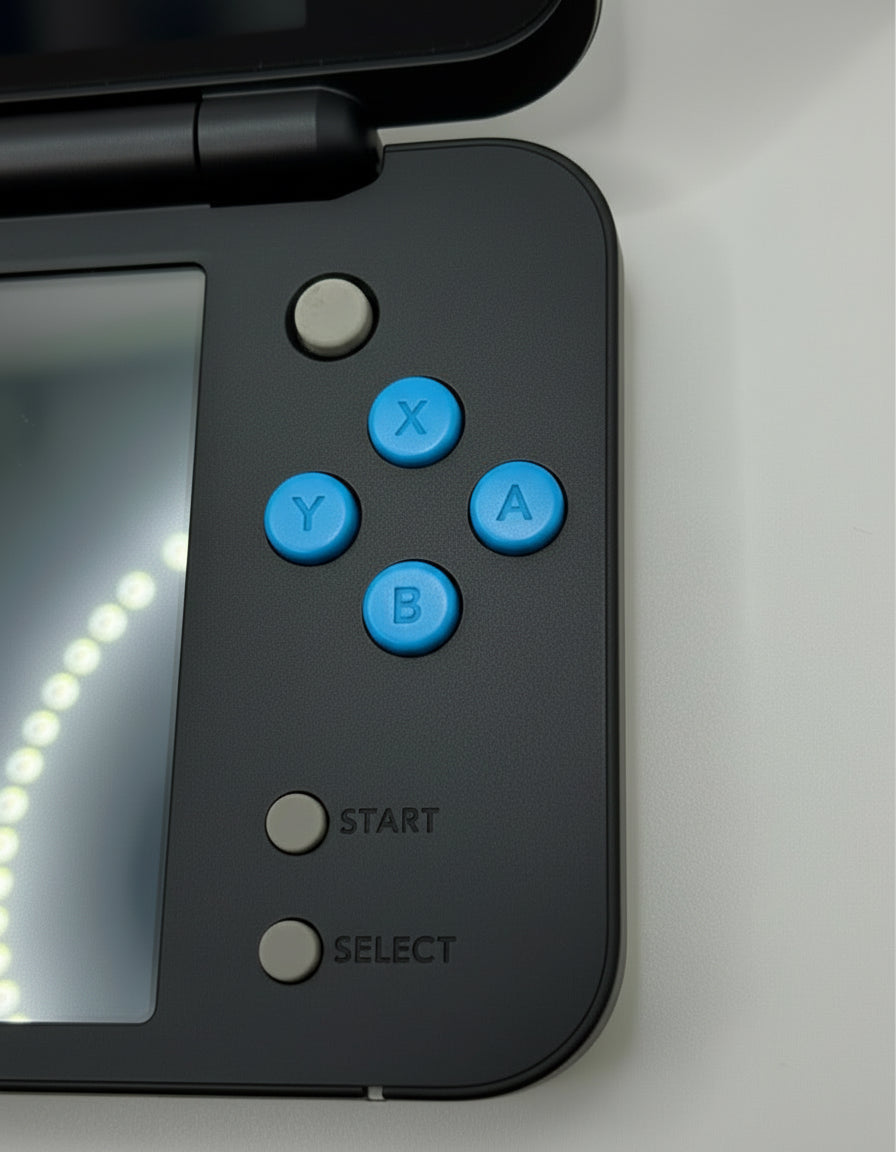 Close-up of a handheld gaming console with control buttons on a light gray background Modded New Nintendo 2DS XL with Luma custom firmware, 128GB SD card, emulators, homebrew apps, and pre-installed software, displayed in excellent condition for retro and 3DS gaming.