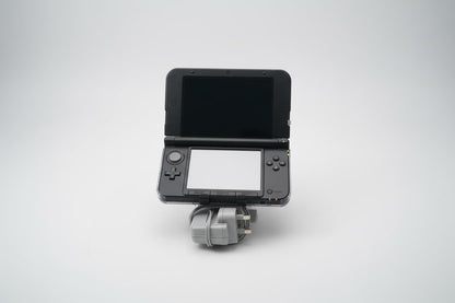 Black modified Nintendo 3DS XL with wrist strap, Luma3DS custom firmware, and homebrew emulators
