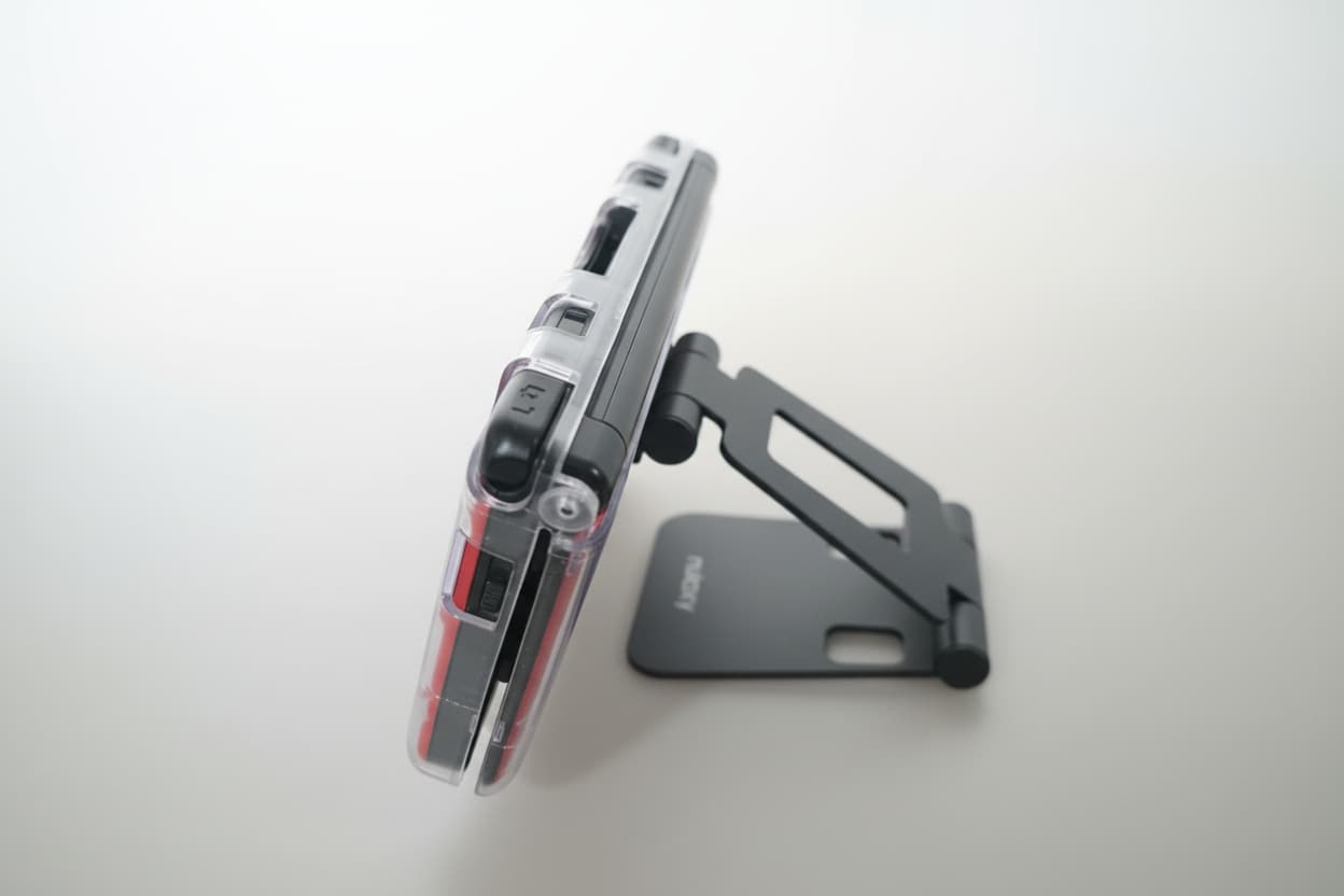 Modified Nintendo 3DS XL on wooden surface with Luma3DS custom firmware and homebrew emulators
