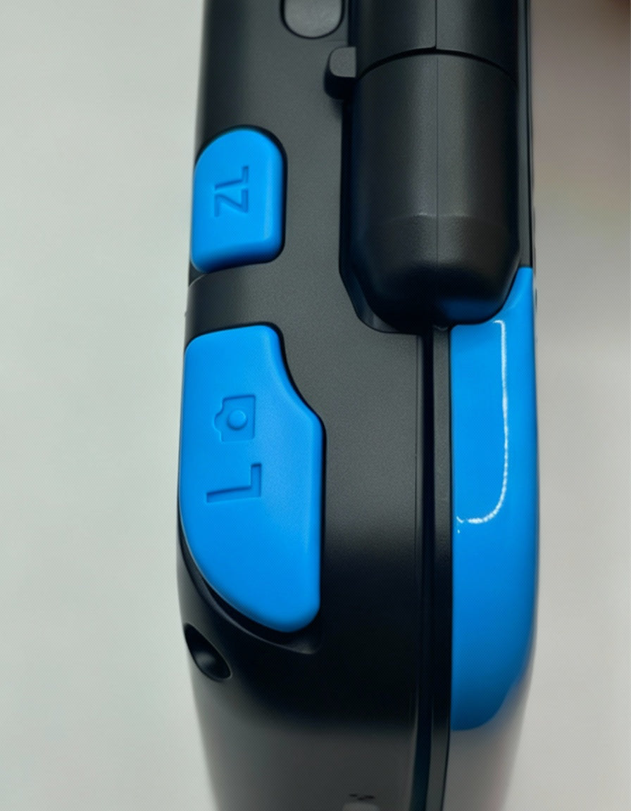 Close-up of a handheld electronic device with buttons on a light gray background