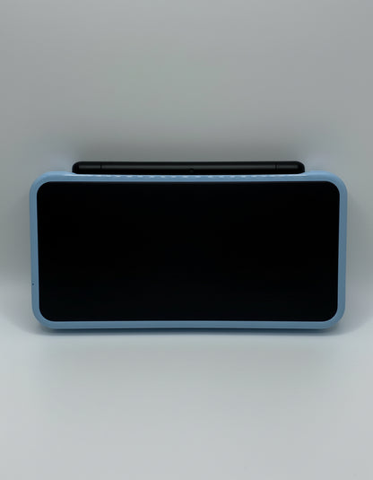 Rectangular electronic device with textured surface and pen on a gray background