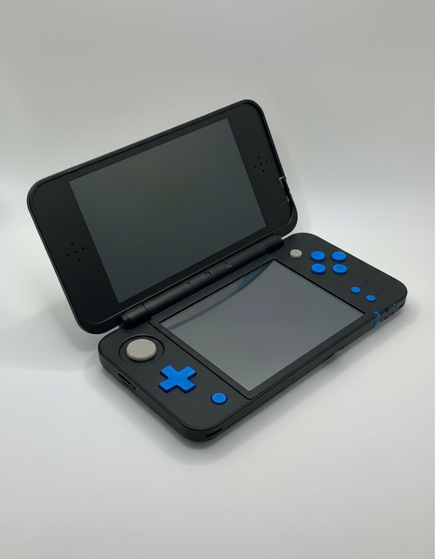 White gaming console with two screens on a gray background Modded New Nintendo 2DS XL with Luma custom firmware, 128GB SD card, emulators, homebrew apps, and pre-installed software, displayed in excellent condition for retro and 3DS gaming.