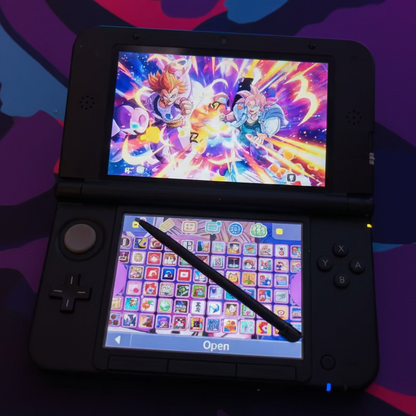 Modded Nintendo 3DS XL black with anime game on screen and preloaded game library visible