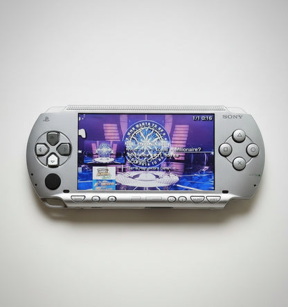Portable gaming device with a screen displaying a game interface on a white background “Ice silver modded PSP 1000 with 128GB SD card, custom firmware, emulators and pre installed games”

“Sony PSP 1000 ice silver jailbroken console featuring 128GB storage, custom firmware and classic games”

“PSP 1000 ice silver modded handheld with custom firmware, emulator support, and 128GB SD card included”