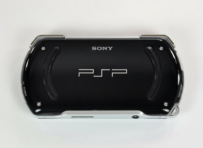 Black Sony PSP gaming console on a white background Black Sony PSP Go modded handheld console with custom firmware and emulators pre-installed, portable retro gaming system for PlayStation and classic console games