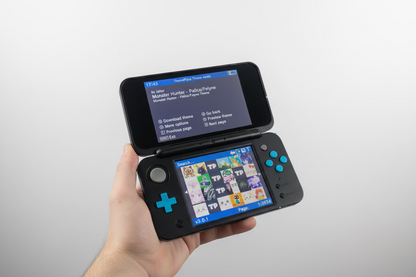 Hand holding a Nintendo Switch with a screen displaying a theme selection Modded Nintendo 2DS blue console 128GB SD custom firmware pre-loaded retro games emulators homebrew menu UK moddingmenu. Custom modded handheld 128GB SD card pre-loaded homebrew games emulators UK professional gaming mod service