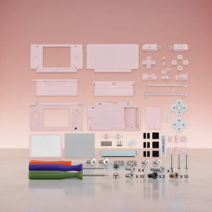 Pink Nintendo DS Lite full replacement shell mod kit with pink buttons, D-pad, L R buttons, stylus, screen lens, hinges, rubber pads, screws, and three screwdrivers on pink background
