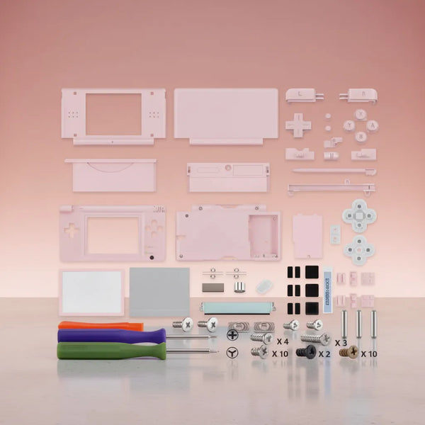 Pink Nintendo DS Lite full replacement shell mod kit with pink buttons, D-pad, L R buttons, stylus, screen lens, hinges, rubber pads, screws, and three screwdrivers on pink background