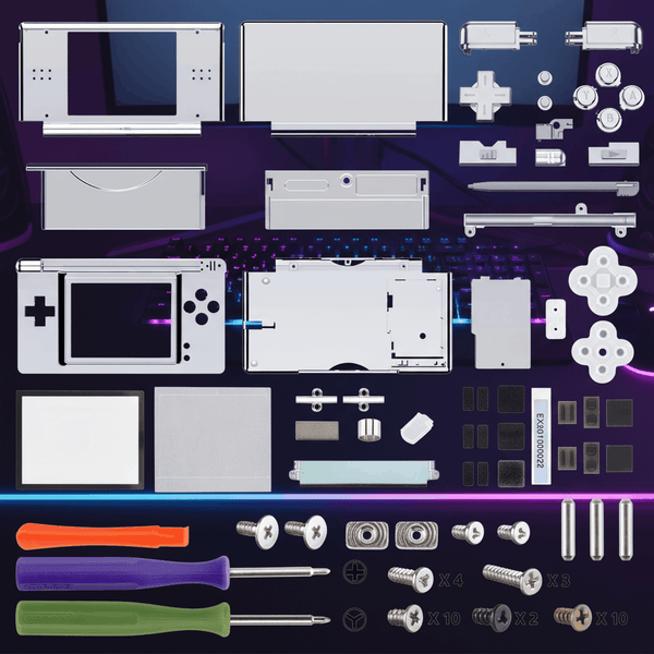 Chrome silver Nintendo DS Lite complete housing replacement kit laid out on purple gaming desk with L R buttons, ABXY buttons, screen lens, full screw set, and tools included