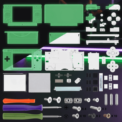 Glow in the dark green Nintendo DS Lite full replacement shell mod kit with buttons, D-pad, screen lens, screws, rubber pads, and three screwdrivers on gaming desk