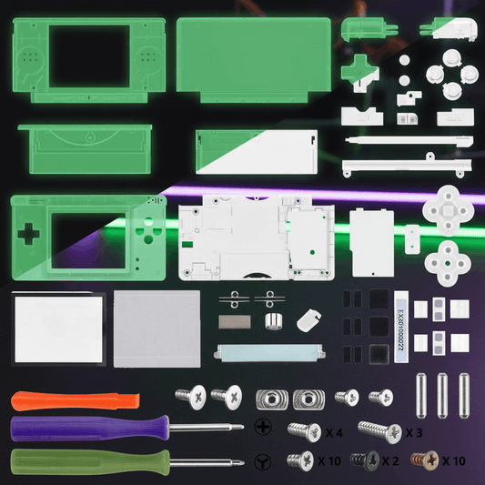 Glow in the dark green Nintendo DS Lite full replacement shell mod kit with buttons, D-pad, screen lens, screws, rubber pads, and three screwdrivers on gaming desk