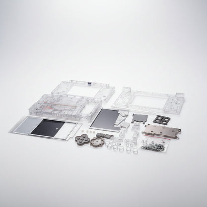 Full Crystal Ghost transparent DSi shell kit flat-lay on white with buttons, frames and screws - ModxGaming UK