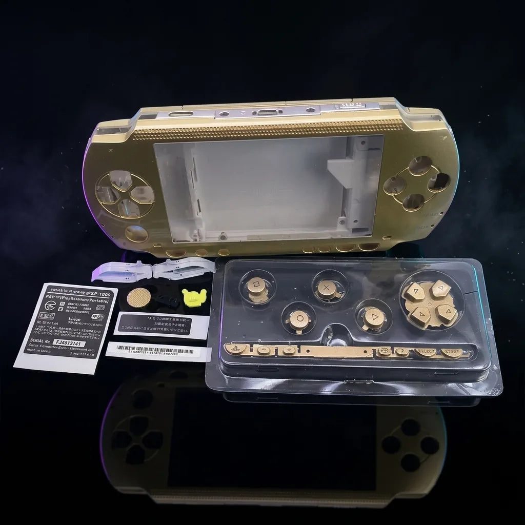Gold PSP 1000 Phat replacement shell kit laid out with buttons and screws, modded PSP housing UK