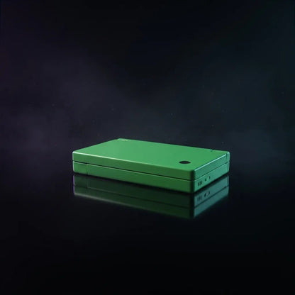 Jade Venom DSi replacement shell in glossy jade green, closed console on a dark smoky background