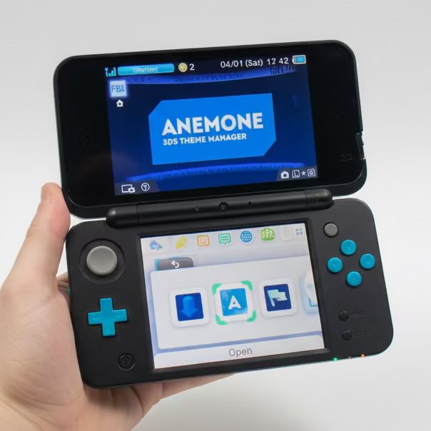 Handheld modded New 2DS XL showing the Anemone theme menu, custom firmware modding service UK