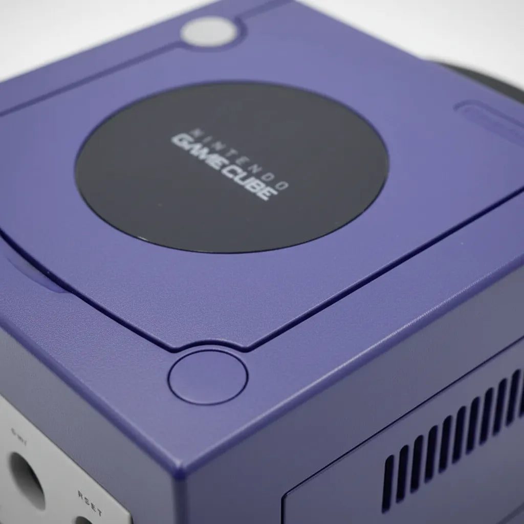 Close-up of an Indigo GameCube disc lid and reset button, modded console with SD card loader – ModxGaming UK