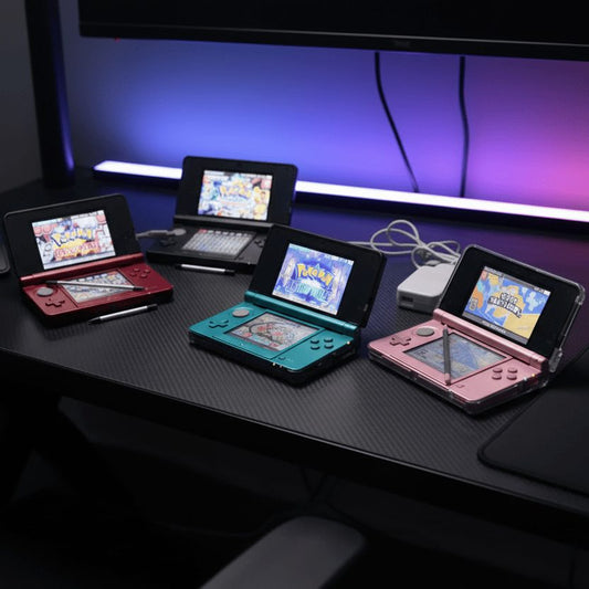 Modded Nintendo 3DS colour range on an RGB gaming desk - Aqua Blue, Flame Red, Cosmos Black and Pearl Pink