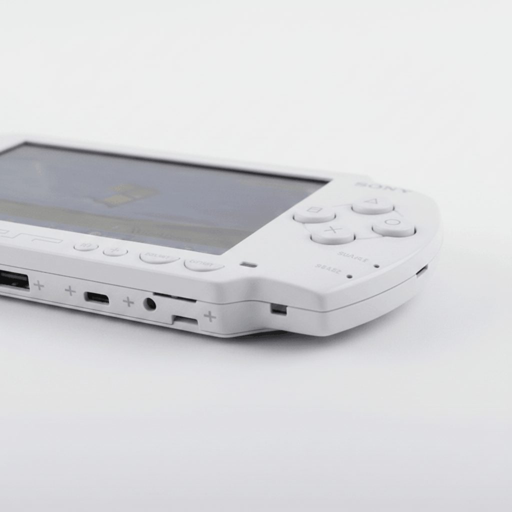 Side view of a modded PSP 1000 showing USB port, headphone jack and memory stick slot, custom firmware console