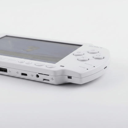 Side view of a modded PSP 1000 showing USB port, headphone jack and memory stick slot, custom firmware console