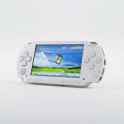Angled Ceramic White modded PSP 1000 displaying a custom XP style theme, CFW and preloaded games ready to buy UK