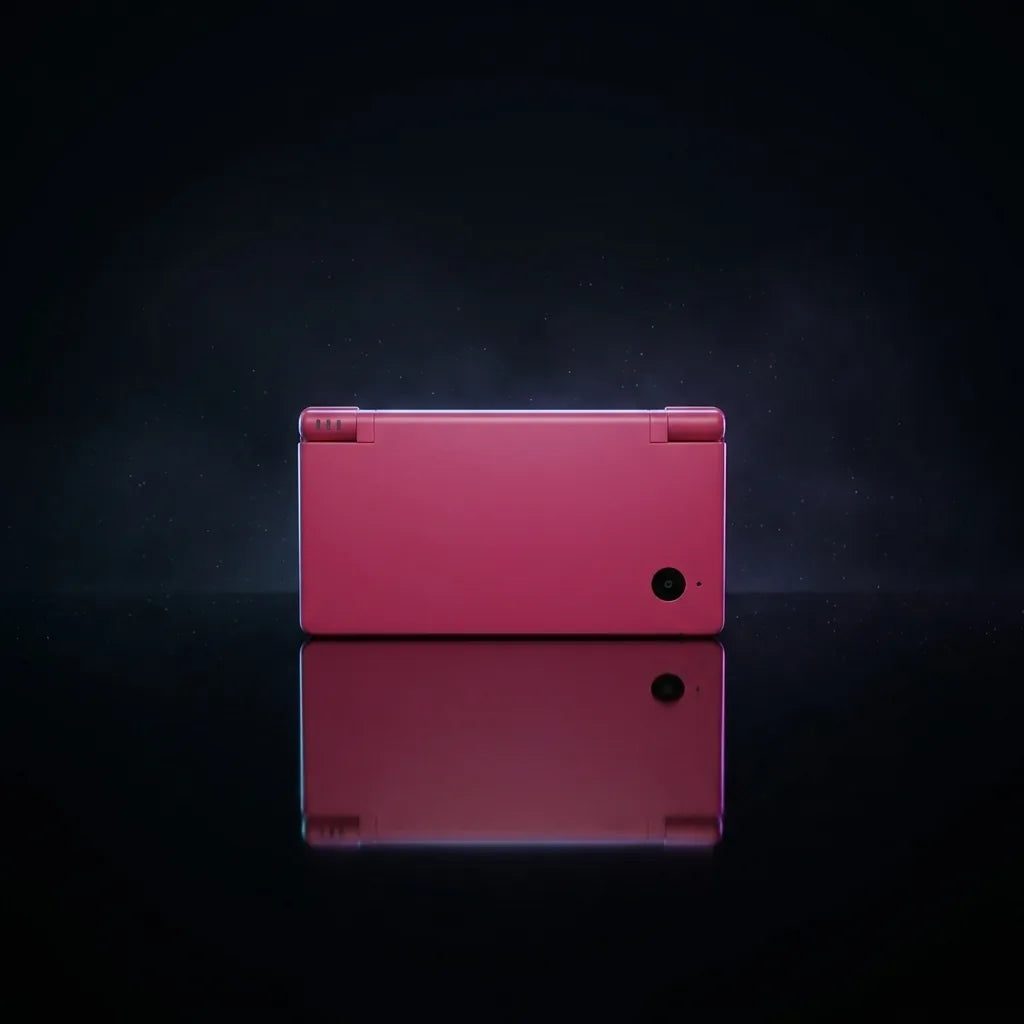 Neon Blossom DSi replacement shell in hot pink, closed console back view on a dark background