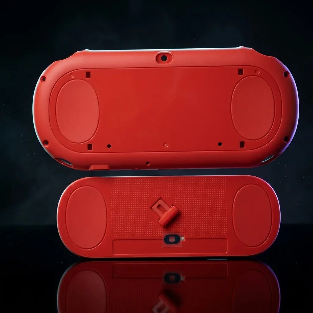 Neon orange PS Vita 2000 Slim replacement shell housing and bottom cover on a dark background - ModxGaming UK