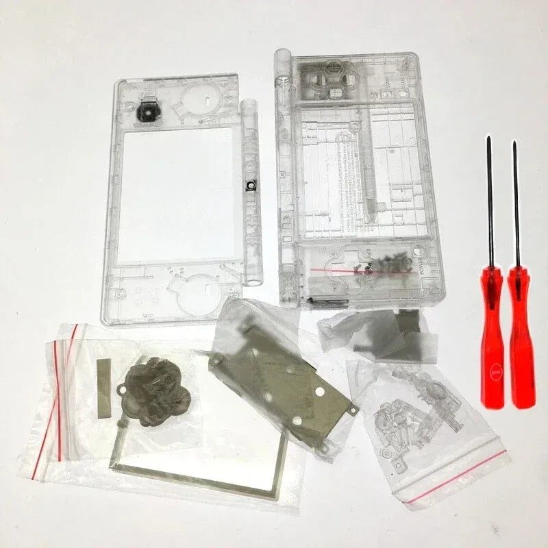 Full Neon Tokyo clear DSi replacement shell kit flat-lay on white with parts, screws and screwdrivers
