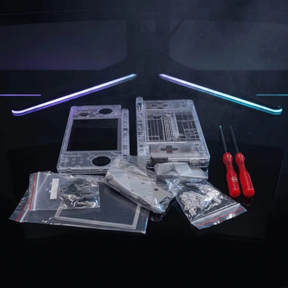 Neon Tokyo clear DSi shell mod kit with two red screwdrivers on a desk with an RGB light bar