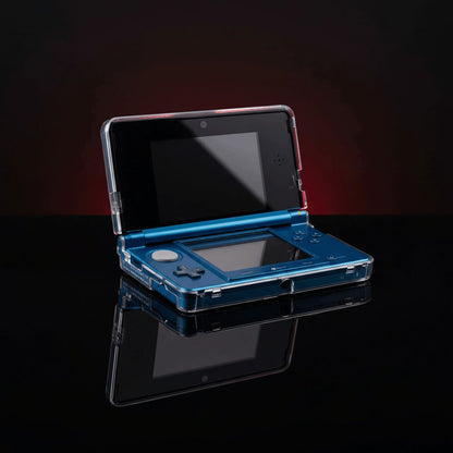 Blue Nintendo 3DS closed inside a clear crystal hard shell protective case with a mirrored reflection, UK
