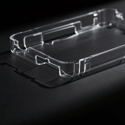 Close-up of an empty clear crystal hard shell case for the Nintendo 3DS showing precise moulded cutouts, UK