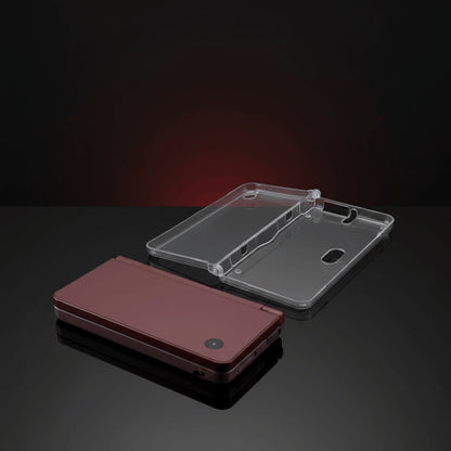 Maroon Nintendo DSi XL closed next to its clear crystal hard shell protective case, slim hard cover, UK