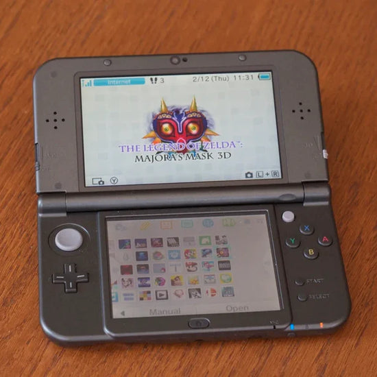 Pink modded Nintendo 3DS XL playing Super Smash Bros with 128GB storage, Luma3DS custom firmware, and homebrew emulators
