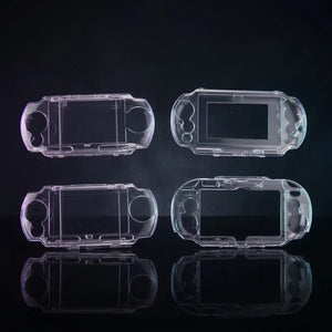 Four clear crystal hard cases for PSP and PS Vita shown together on a dark studio backdrop – ModxGaming UK