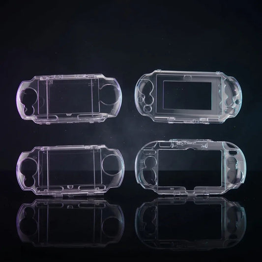 Four clear crystal hard cases for PSP and PS Vita shown together on a dark studio backdrop – ModxGaming UK