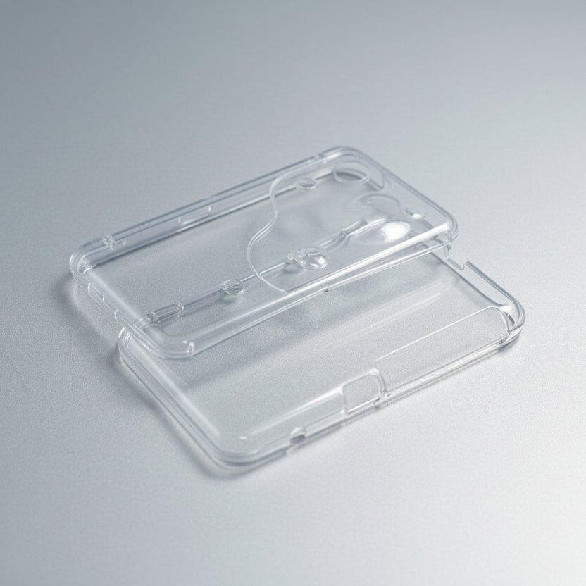 Transparent Slime Surge Limited New 2DS XL shell halves showing the clear housing on grey
