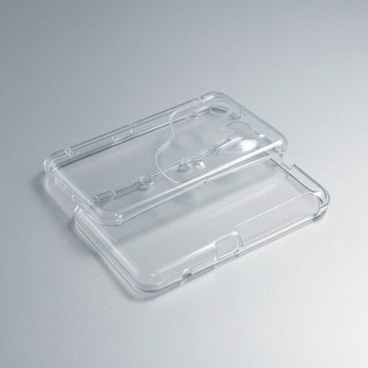Transparent Slime Surge Limited New 2DS XL shell halves showing the clear housing on grey