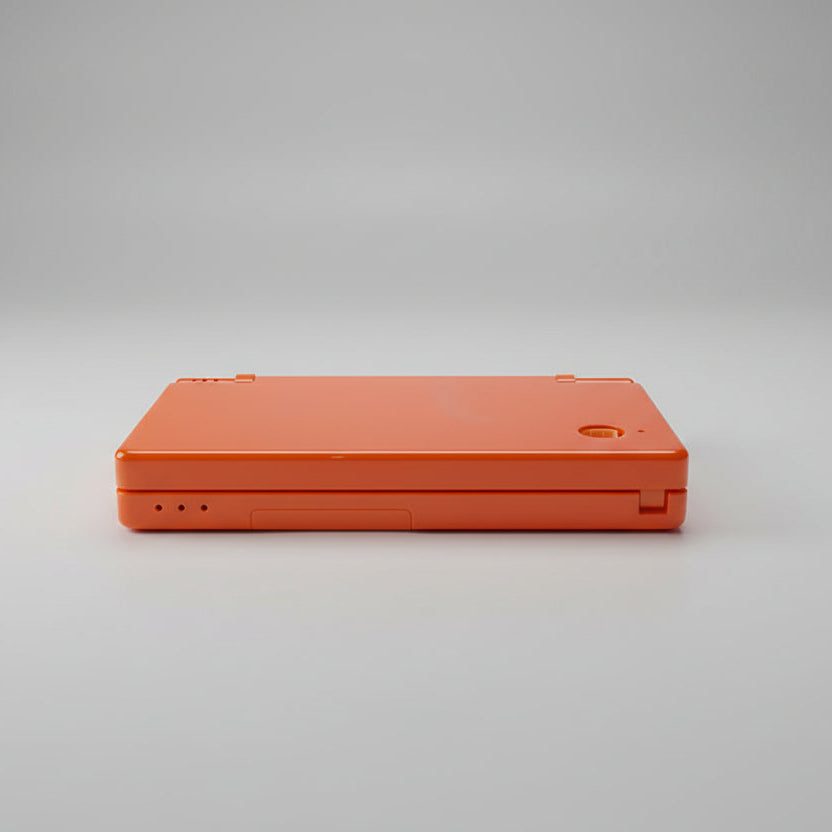 Solar Flare Orange DSi replacement shell shown on grey, warm orange console housing to buy UK