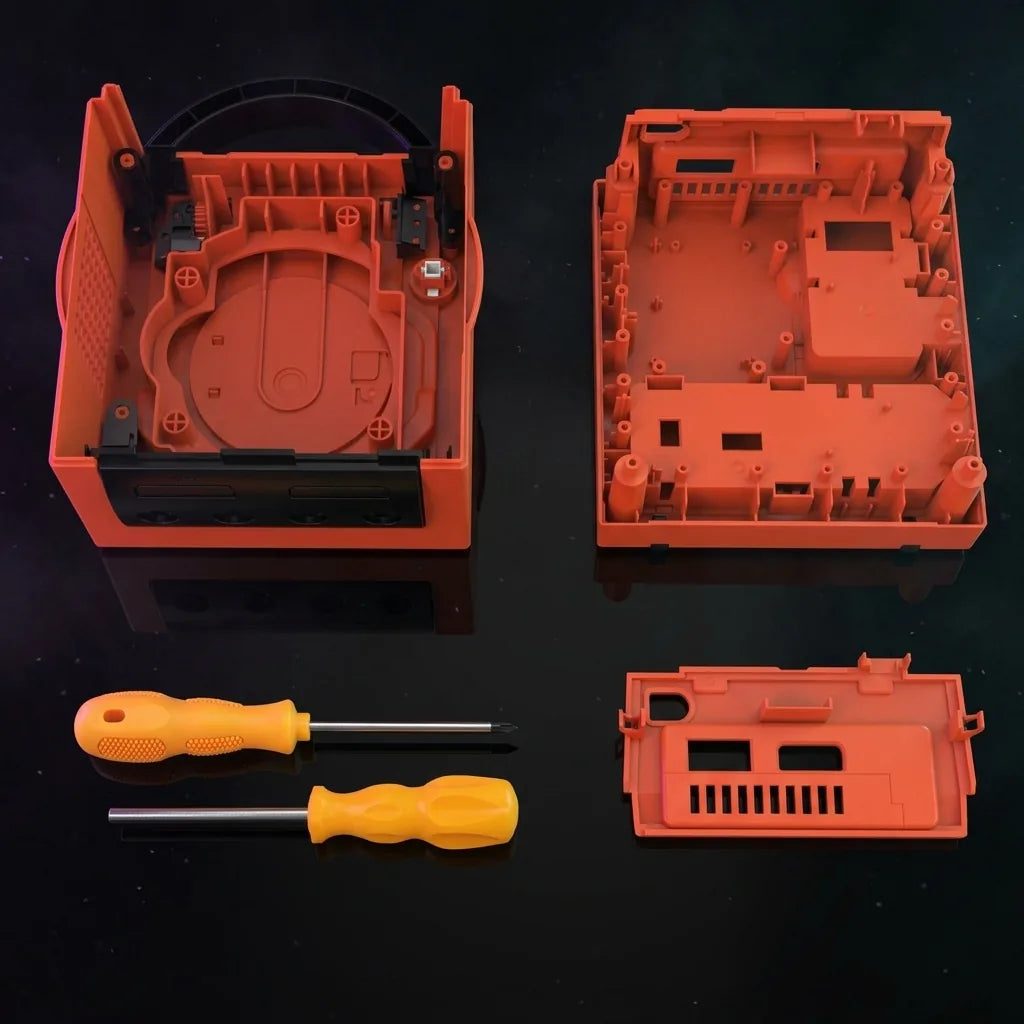 Warm Red Nintendo GameCube replacement shell halves laid out with screwdriver tools, modded GameCube housing kit UK