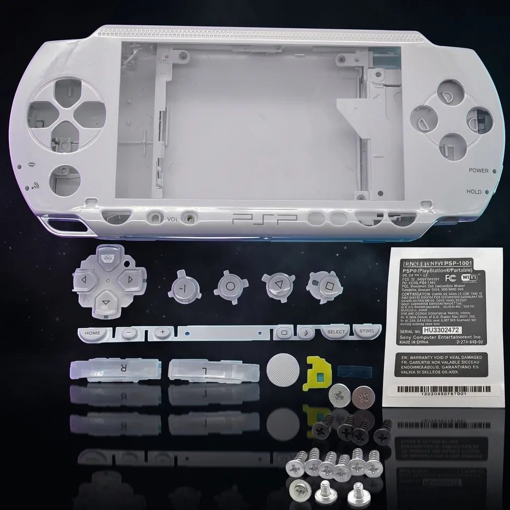 White PSP 1000 Phat replacement shell kit laid out with buttons and screws, modded PSP housing UK
